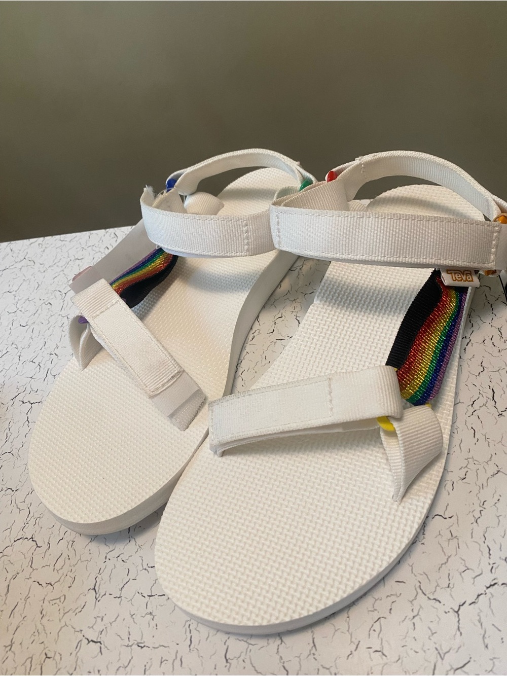 Teva White Sandals with Rainbow Webbing Detail
